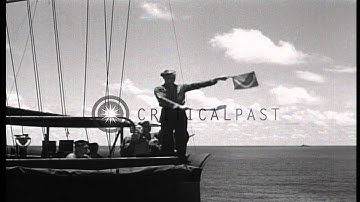 US transports, destroyer escort, and LST (Landing Ship, Tank) underway during Wor...HD Stock Footage