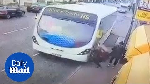 Shocking moment shuttle bus sends pedestrian flying across pavement