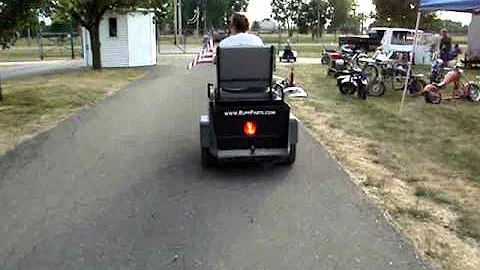 Tina rides a Cushman Minute Miser
