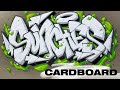 Sasha sunches graffiti on cardboard