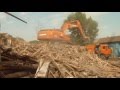 Asian excavator destroys old house - day 2