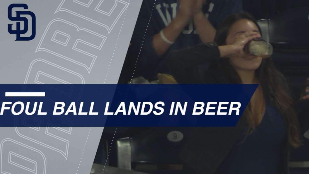 Padres fan catches ball with beer, then becomes a legend