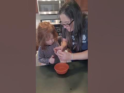 Ellie learns how to crack an egg - YouTube