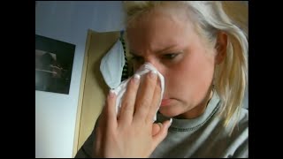 Blonde Woman blow her nose