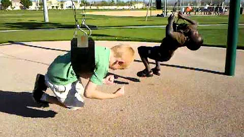 Jeremie and Kyle spinning at the park