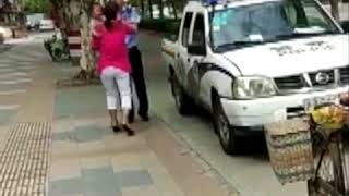 Police Officers In China Slammed A Women Down When She Was Holding Her Baby