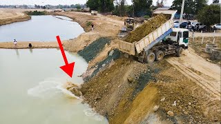 Best working Truck Moving huge Big Stone Unloading in Water on the canal by komat’su pushing soil