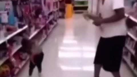 Little kid gets sprayed by silly string.