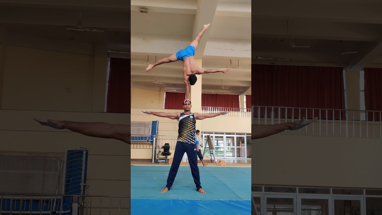 One arm hand stand on head with transaction