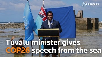Tuvalu minister gives COP26 speech from the sea