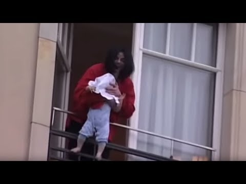 Michael Jackson dangles his baby over a hotel balcony