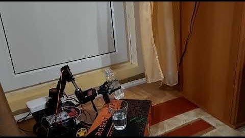 Real-life assisted experiment by using a robotic arm controlled by LabVIEW application and NI myRIO