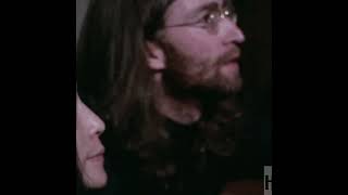 John Lennon looks at footage of himself performing at the Cavern Club in 1962. Resimi