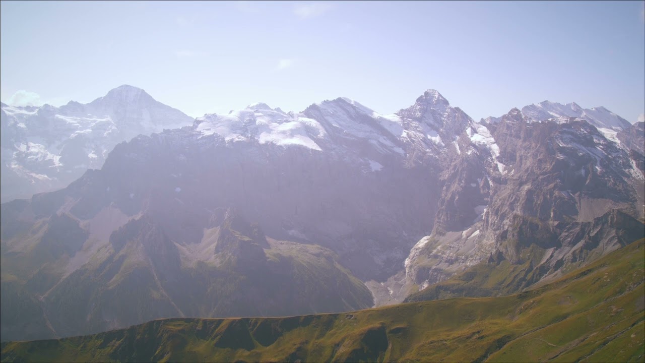Static shot of snow capped mountains in Switzerland FREE STOCK VIDEO