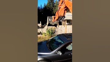 Loading an Excavator into a Dump Trailer