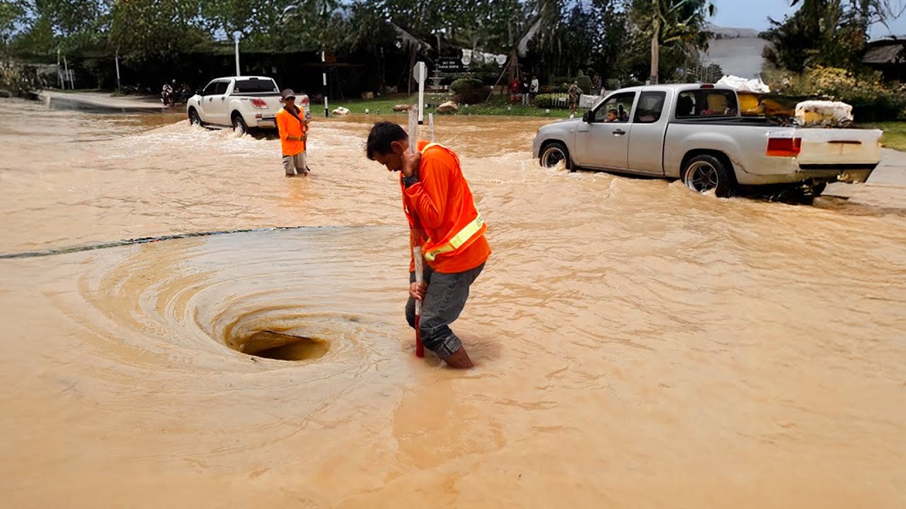 Unclogging a Massive Flood Clearing a Huge Street Flood - YouTube