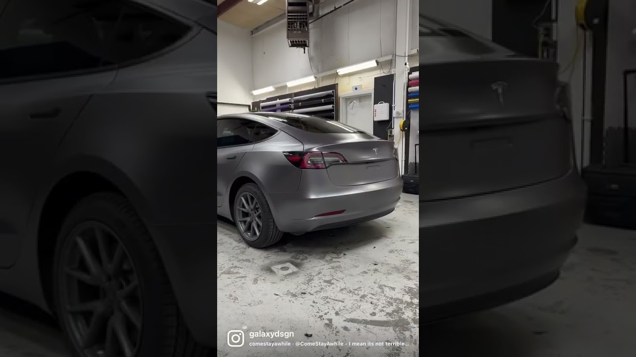 Tesla model 3 wrapped in 3m satin dark grey.