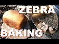 ZEBRA Pot Dry Baking A Loaf Of Bread In The Camp Oven On The Firebox Stove.