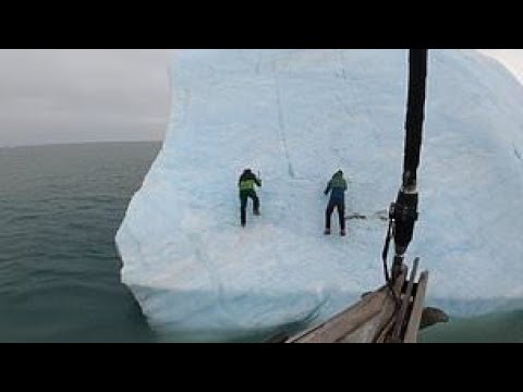 Iceberg flips upside down and hurls explorers into Arctic waters