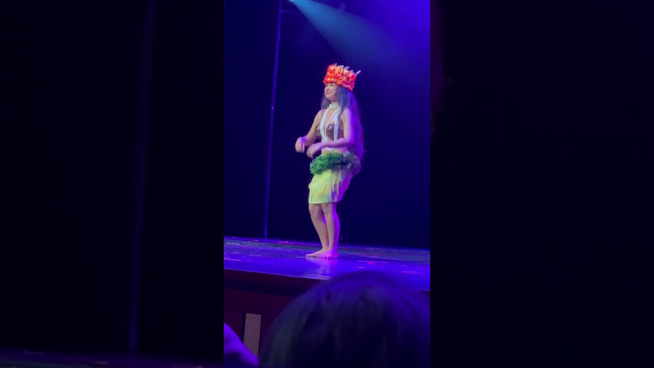 Beautiful hula girl is dancing a fun hula dance. 