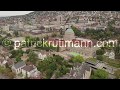 Aerial drone shot flying backwards above Zürich Switzerland showing ETH and UZH