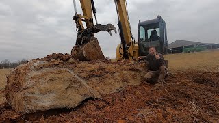 DIGGING OUT A MASSIVE ROCK WITH THE CAT 308. LAND CLEARING