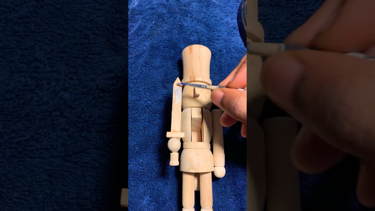 Painting A Wooden Nutcracker Ultramarine Blue With An Argent Silver Sword
