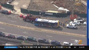 12 hurt in crash between MTA bus and dump truck