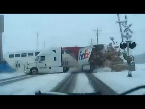 Dramatic crash between truck, train caught on camera