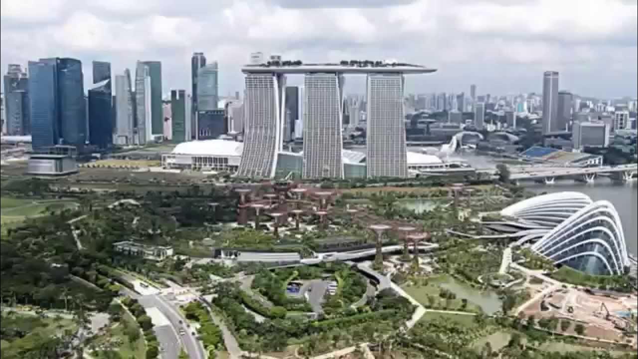 Паданг сингапур. Сингапур с высоты самолета. Статуя мерлиона в сингапуре. Башни гэйпвей сингапур. Сингапур самолет.