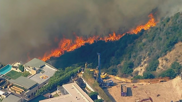 Fast-moving fire threatens Pacific Palisades homes