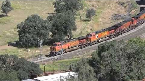 BNSF 5 diesels round curve to enter tunnel with doublestack containers at Tehachapi CA