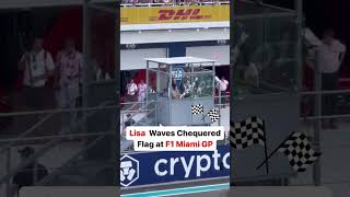 #Lisa Attends #2024F1Miami Grand Prix, waves chequered flag and snaps pic with Formula 1 Champion