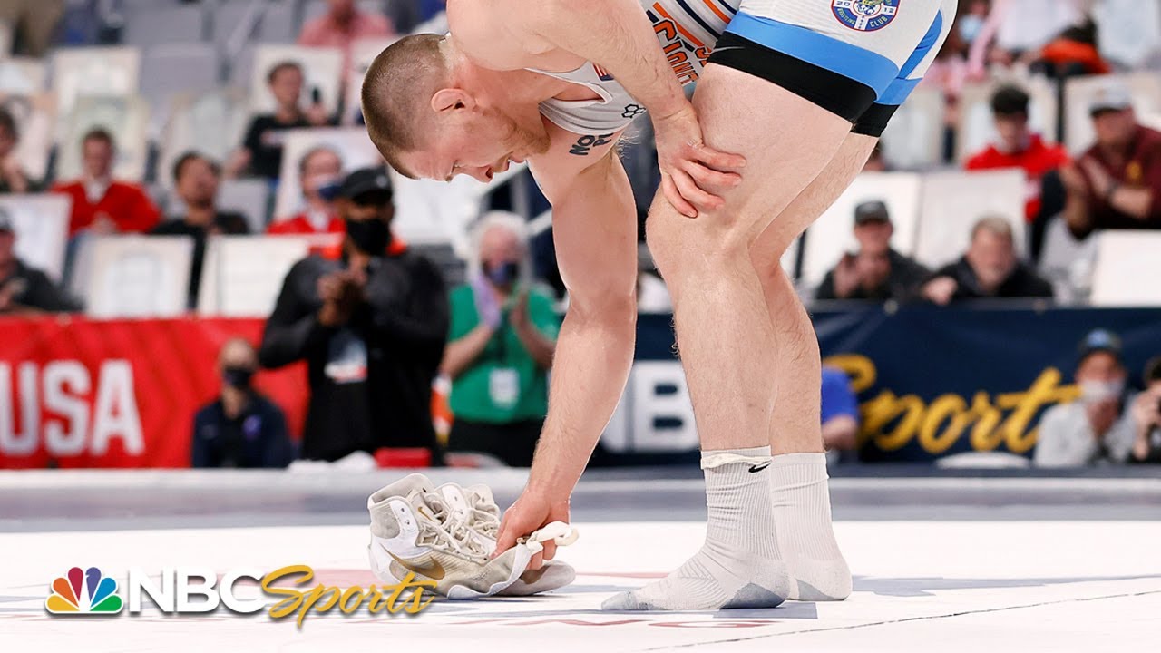 Why do wrestlers leave their shoes on the mat? With world champion