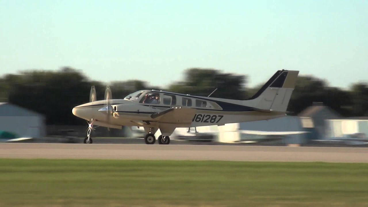 Beech 58P Baron departing KOSH on 8/1/13 at 1916