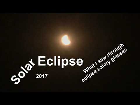 Glimpse of Solar Eclipse Through NASA Approved Eclipse Glasses Glimpse of Solar Eclipse Through NASA Approved Eclipse Glasses