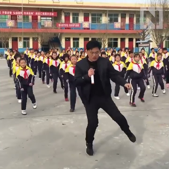 Is this the coolest teacher on the planet? 700 Chinese students perform perfect dance routine
