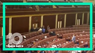 Loud bang heard as armed Capitol Police block door from protesters outside House chamber