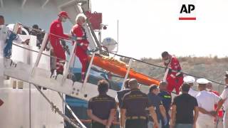 Ship carrying 931 migrants docks in Sardinia