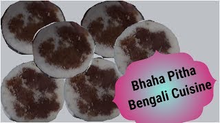 A woman selling bhapa pitha or steamed rice cake of bengal. for more
details click on -
http://www.indiavideo.org/westbengal/cuisine/bhapa-pitha-6845.php