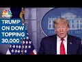 President Donald Trump touts Dow 30,000 milestone