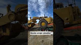 Watch This Massive CAT 637D Scraper Roll Off the Lowboy! 😱 #heavyequipment #caterpillar #mining #fyp