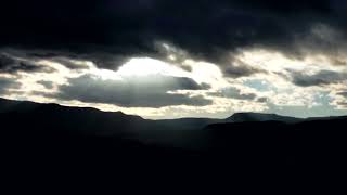 Sun Behind Clouds. Time Lapse Sun rays