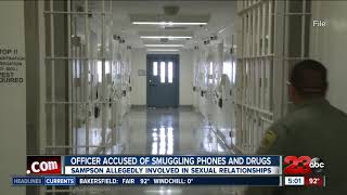 Officer accused of smuggling phones and drugs