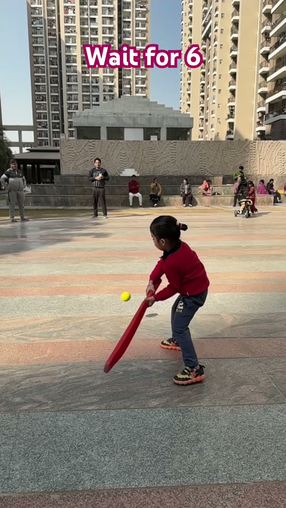 Little baby playing cricket