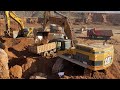 Two Caterpillar 365C Excavators Loading Trucks