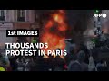 Fires, sounds of explosions as thousands protest new security law in Paris | AFP