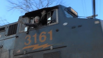 CSX Intermodal Train With A Geometry Boxcar