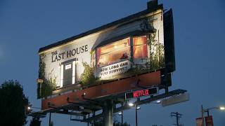 Man living inside billboard above Los Angeles street for Netflix movie promotion