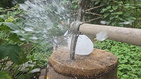 Giant ice cubes vs big hammer-pickaxe - board of nails-axe-drilling machine- sickle-hammer-Slow-mo